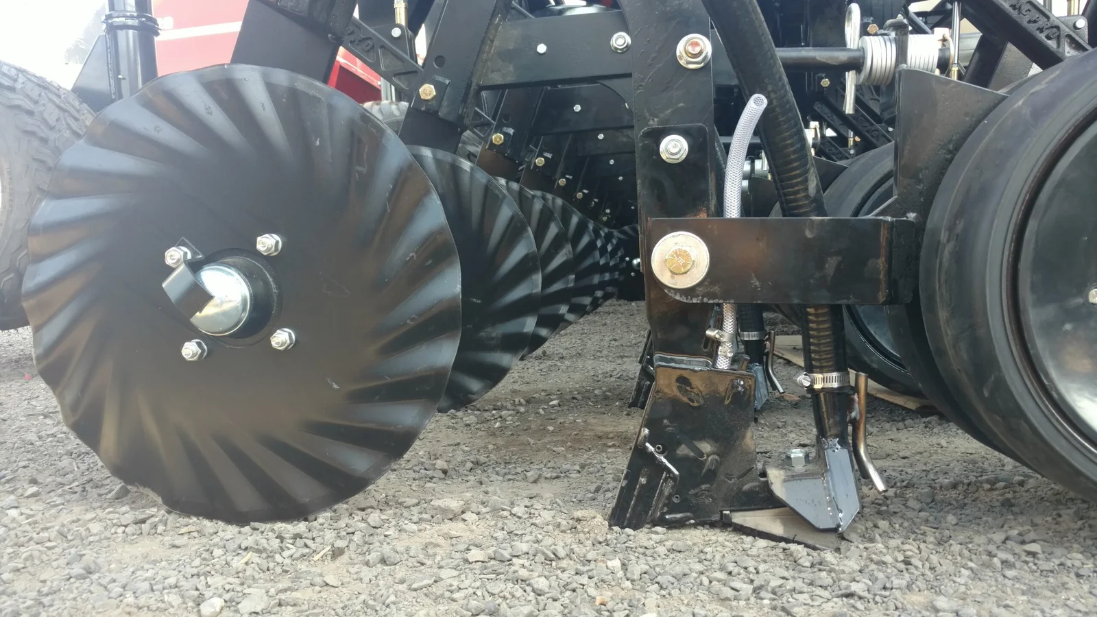 AGPRO paired row opener and fluted coulter mounted beneath a conservation drill