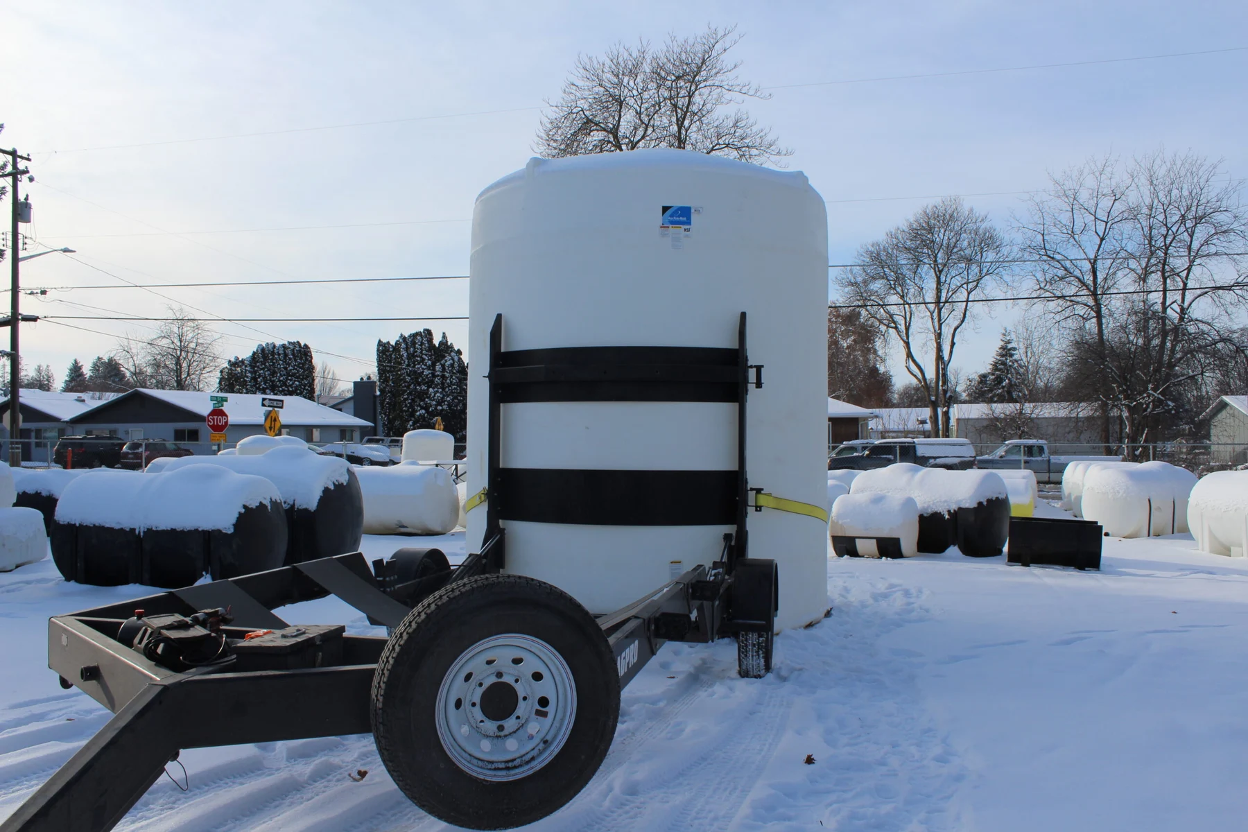 AGPRO tilt trailer with a free-standing tank in the upright position